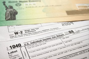 Picture of a tax refund check on top of 1040 tax return.