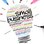 Drawing of light bulb with small business words and phrases written inside bulb