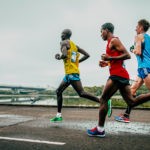 Picture of Omsk, Russia - September 20, 2015: three leaders of the marathon running along the embankment of the Irtysh river during Siberian international marathon