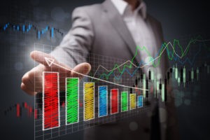 Picture of Businessman pointing to a growth chart showing business success