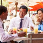 Picture of business people having lunch of for meals and entertainment deduction rules for 2018 blog post