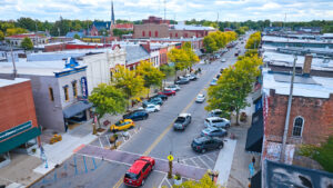Real estate investment that an entrepreneur should consider blog post art: Small busineses in a downtown village.